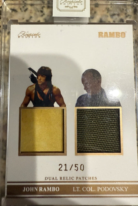 2025 Super Break Keepsake - John Rambo / Podovsky - #117 Dual Relic #d 21/50